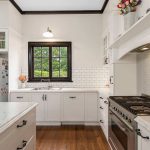 Renovated Kitchen with black handles| Sheridan Stone AUST.